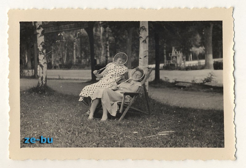   PHOTO YOUNG WOMEN in POINTED DRESS COVER FACES w/ BADMINTON RACKET