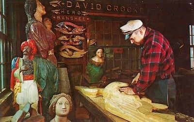 CT   MYSTIC SEAPORT A WOOD CARVER WORKS ON A TRANSAM EAGLE  C101210 