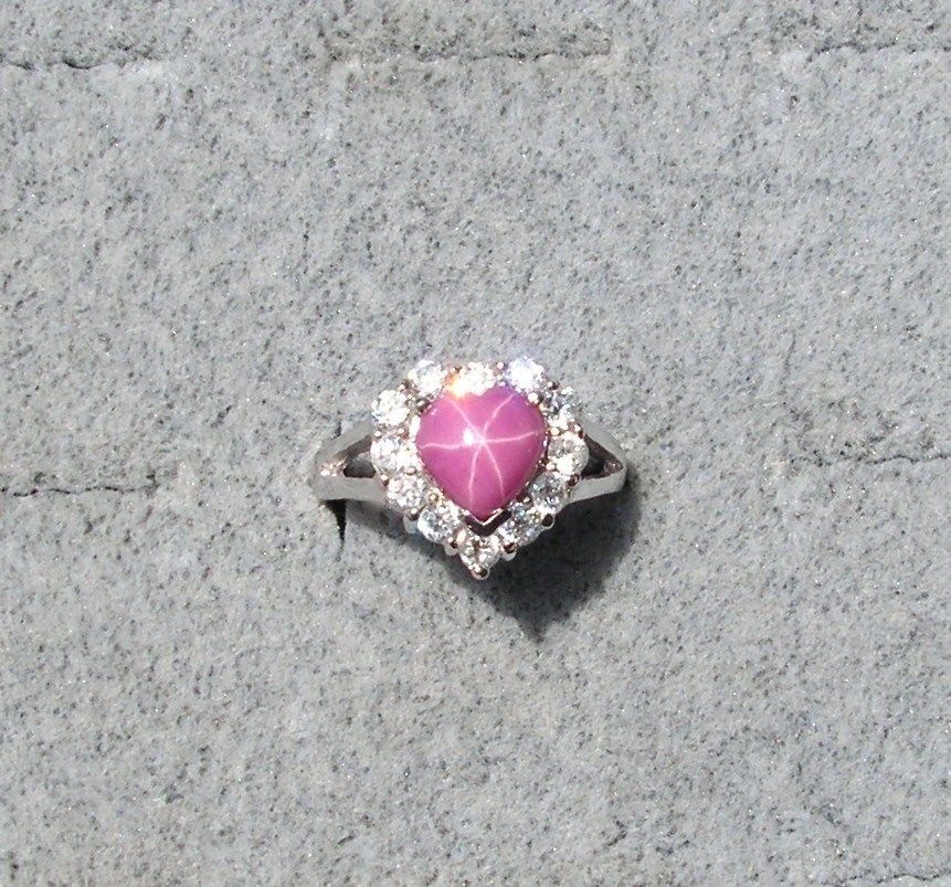   PINK STAR RUBY CREATED SAPPHIRE ACCENTED HEART RHODIUM PLT S/S RING