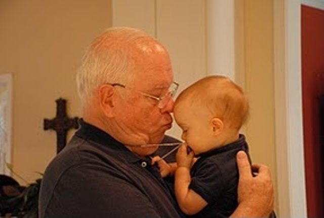 Lamberts 13 month old grandson, Thomas Anthony Rueda, kisses his 