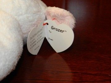 This is a 2002 Ty Pluffies cow named Grazer Grazer is in good used