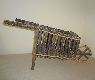 Folk Twig Branch Art Wheelbarrow with Round Wheel Decor Piece